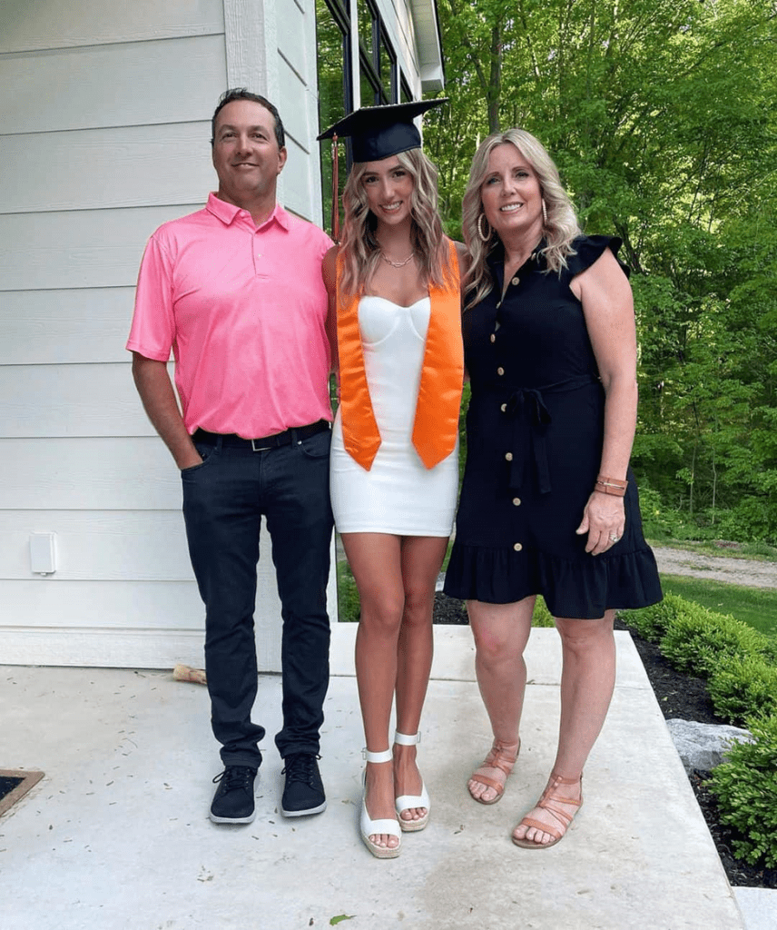 Lilia Schneider with her parents for her graduation 